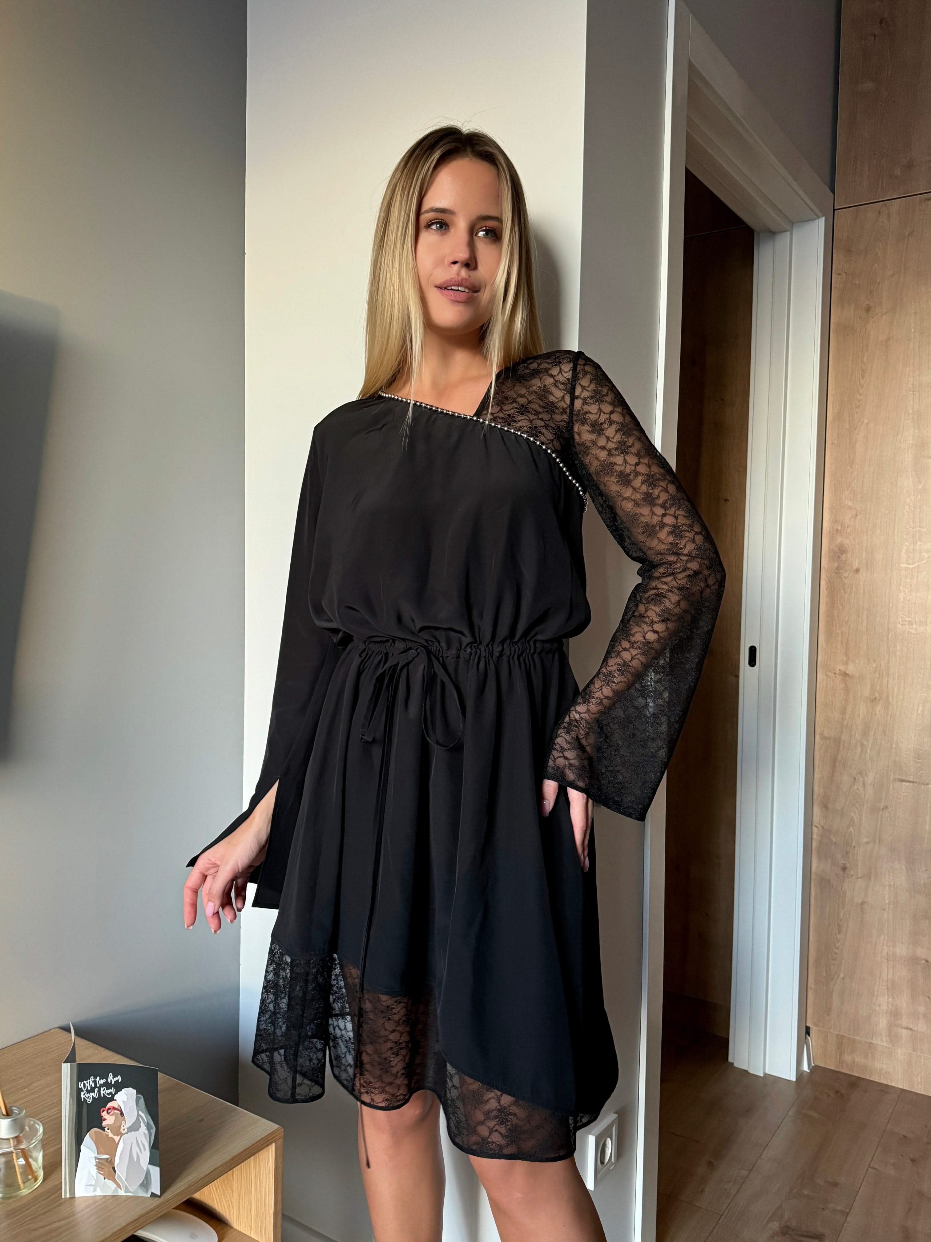 dress made of natural silk adorned with lace