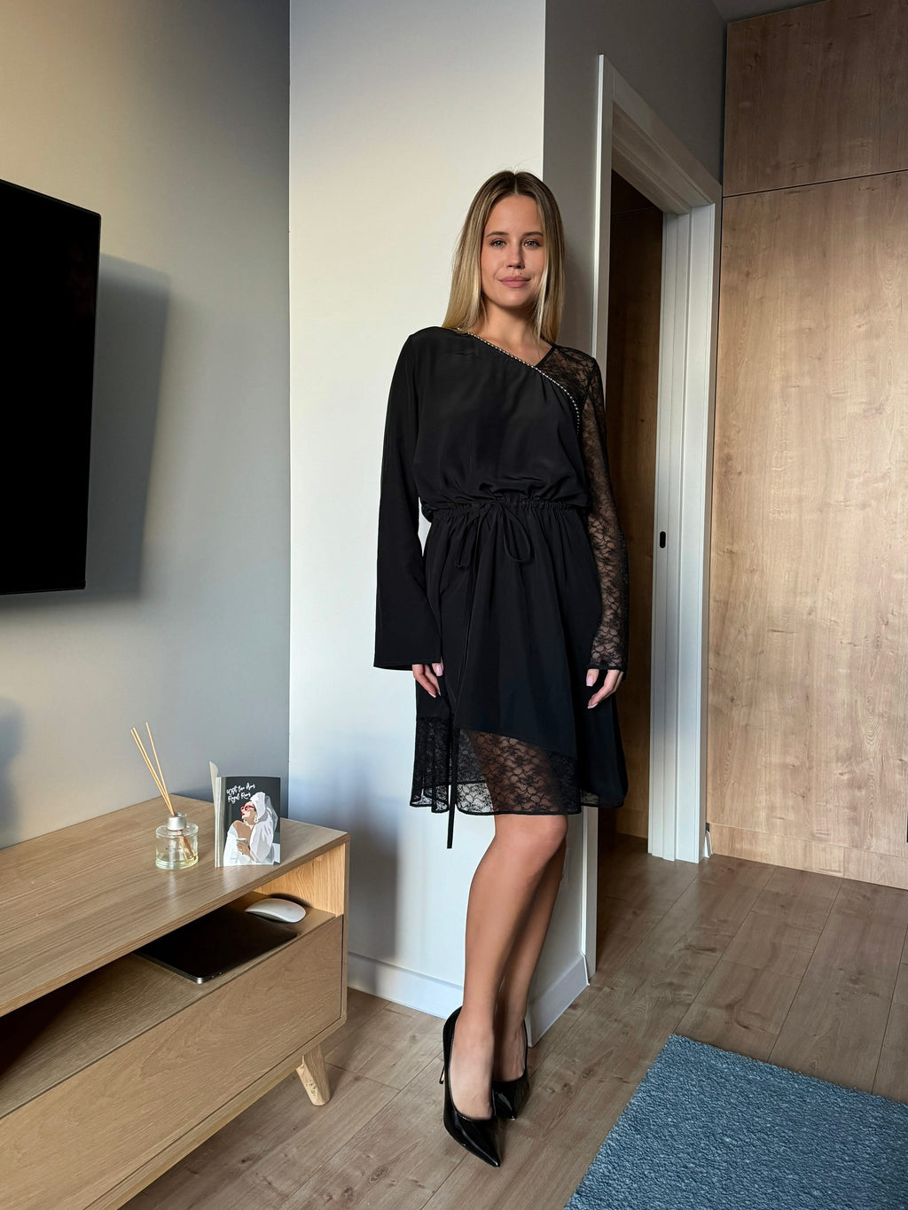 dress made of natural silk adorned with lace