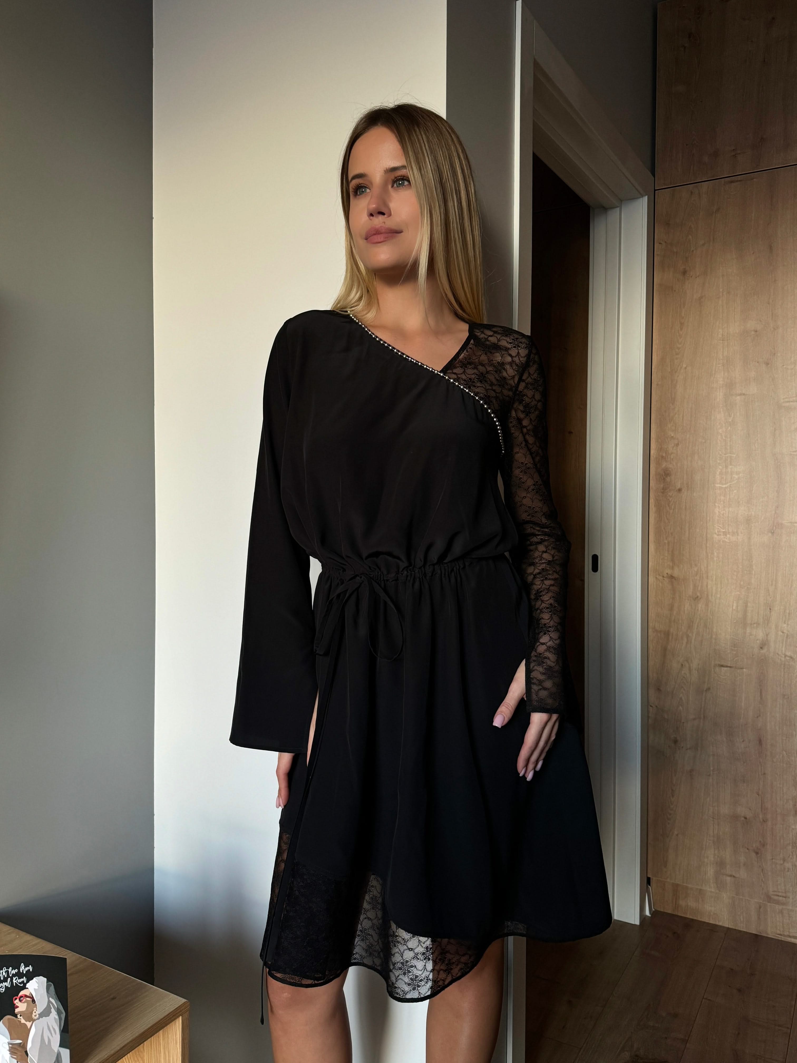 dress made of natural silk adorned with lace